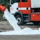 Foam fire extinguisher being deployed