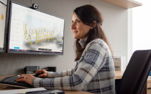 Woman working on computer with images on her screen